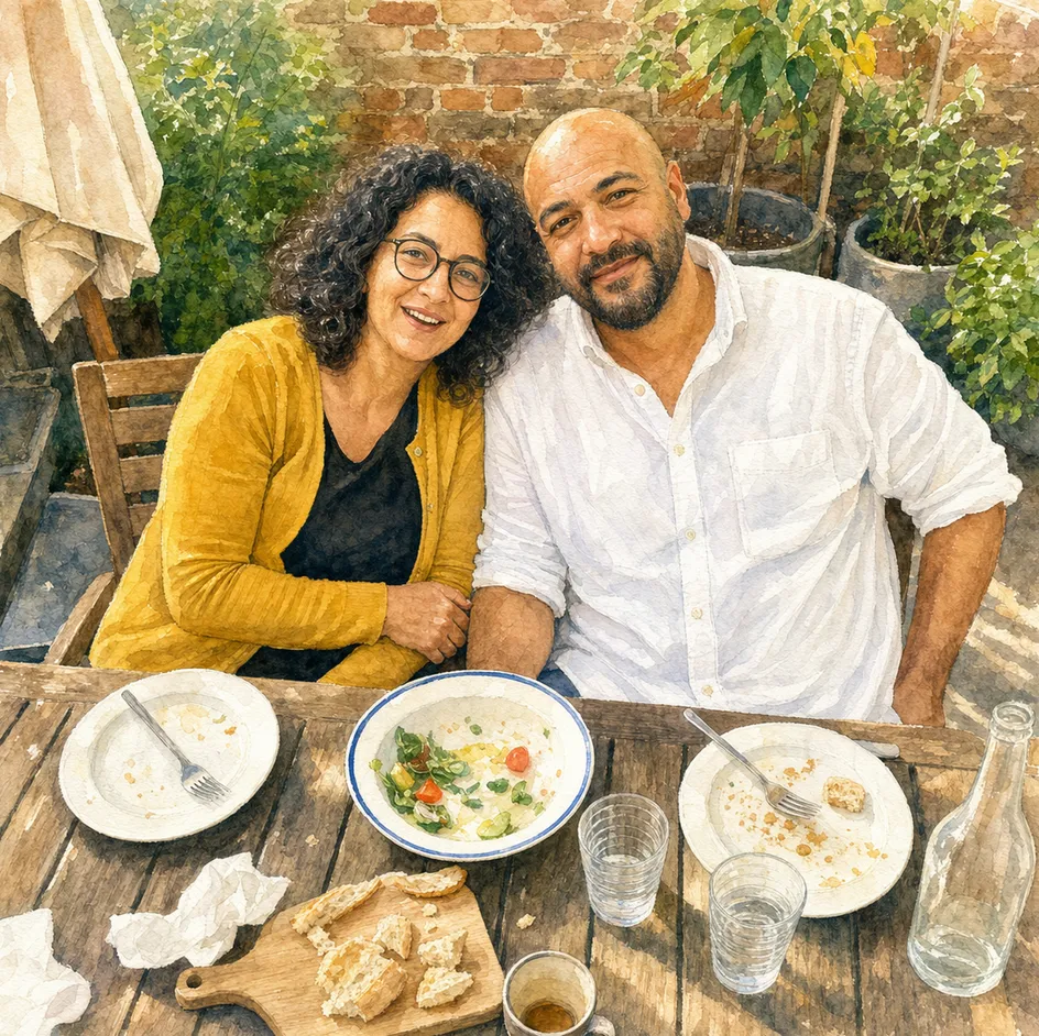 Watercolour comic panel: Nadia and Karim at the same table, storybook style